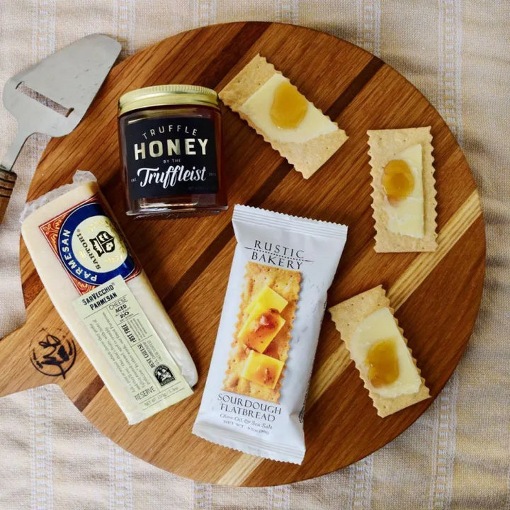 Truffle Honey on a board with crackers